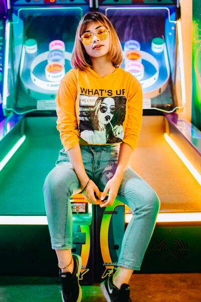 Glossy tech palettes and subtle web-era compression with cyan-magenta pop.